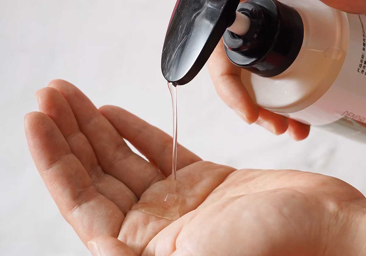 Close-up of Dendrobium Essence Water in a bottle, providing skin with moisture and rejuvenation.